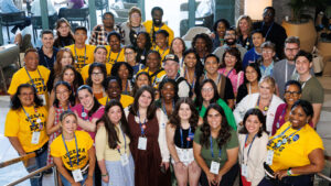 Group of attendees at Eczema Expo 2025 smiling at the camera